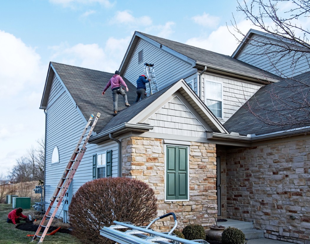 Reilly Roofing Company - Roofers Making Repairs to Storm-Damaged Roof